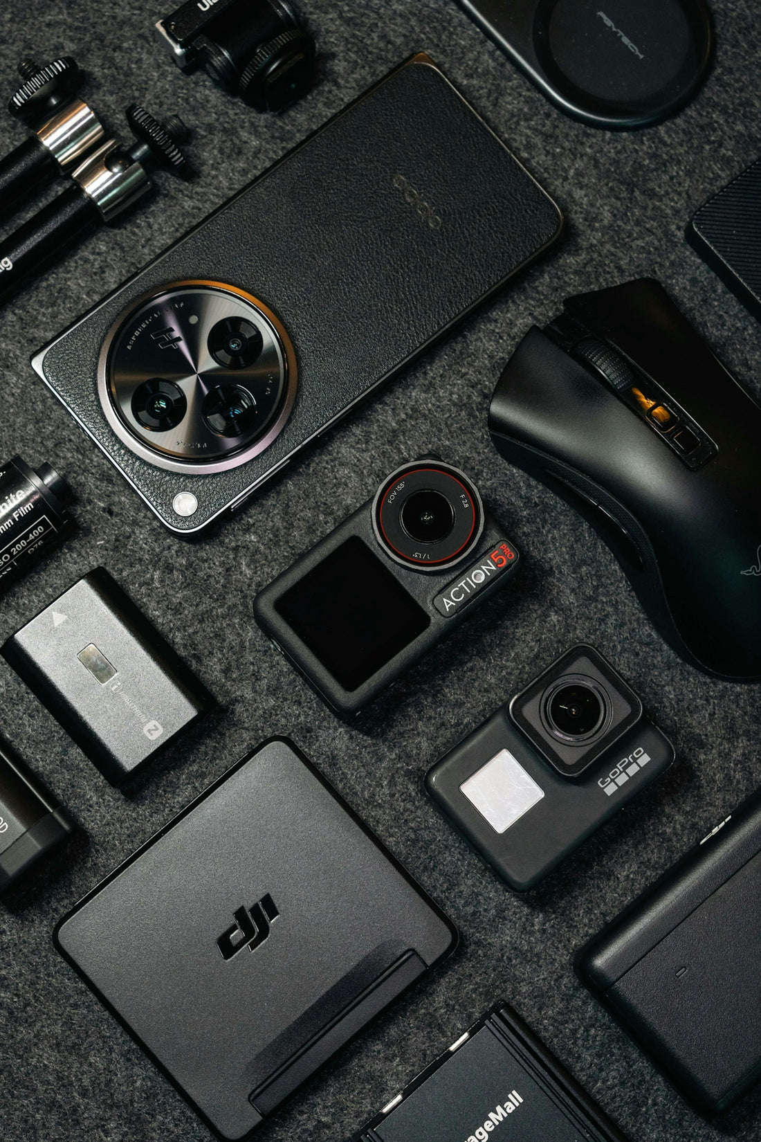 Tech gadgets and accessories arranged on a dark background