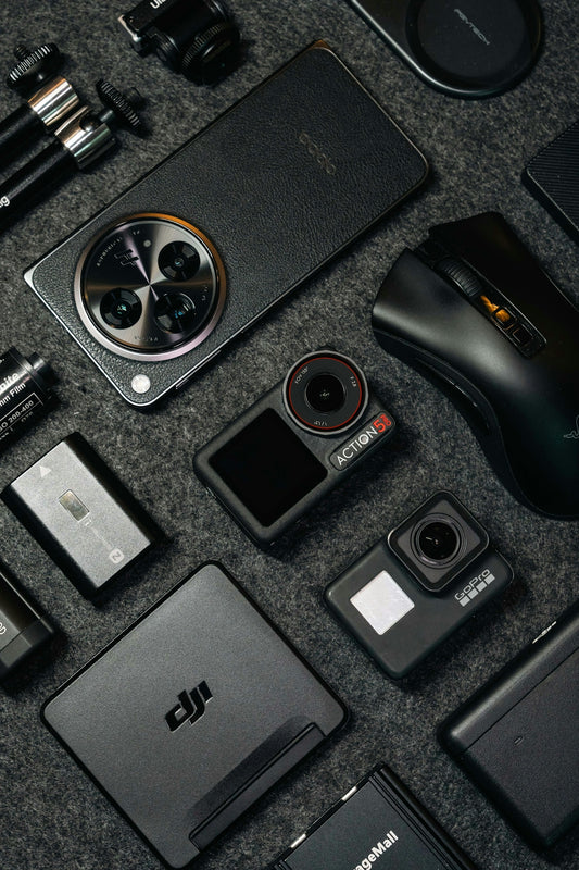 Tech gadgets and accessories arranged on a dark background