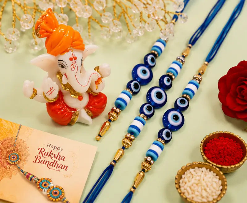 Rakhi Gift Combo Set for Brother – Set of 3 Evil Eye Rakhi with Ganpati Idol, Roli Chawal & Haldi | Raksha Bandhan Gift Pack